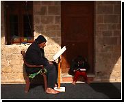 A Palestinian grandfather and his granddaughter reading the Quran during the holy month of Ramadan in the city of Gaza, Palestine. from grandfather drinking his granddaughter boobs