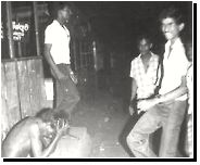 Black July, an anti-Tamil pogrom; a stripped naked Tamil youth sits on a concrete step at the Borella bus stand as a laughing Sinhalese mob dances around him. Later, petrol is poured on the youth, and he is burnt alive. July 1983. from tamil saml girl